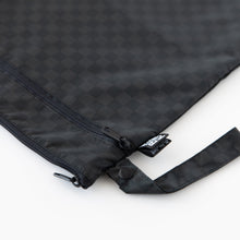 Load image into Gallery viewer, Close-up of Roamio by Bumkins Wet/Dry Bag: Rich Black, featuring zippered compartments and a side handle, on a white background.
