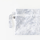 Roamio by Bumkins Wet/Dry Clutch: Disco Check lays flat on a white background.