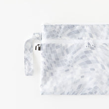 Load image into Gallery viewer, Roamio by Bumkins Wet/Dry Clutch: Disco Check lays flat on a white background.
