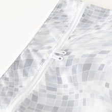 Load image into Gallery viewer, Close-up of Roamio by Bumkins Wet/Dry Clutch: Disco Check on a white background, with focus on the dual zipper.
