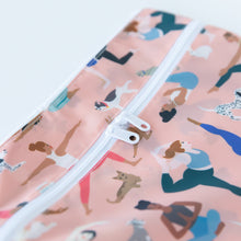Load image into Gallery viewer, Close-up of Bumkins Wet/Dry Clutch: Yoga Pals, with a white zipper and yoga-themed pattern, made from waterproof fabric.
