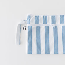 Load image into Gallery viewer, Roamio by Bumkins Wet/Dry Clutch: Nautical Stripe lays flat on a white background.
