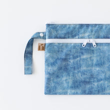 Load image into Gallery viewer, Roamio by Bumkins Wet/Dry Clutch: Crushed Denim lays flat on a white background.
