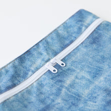 Load image into Gallery viewer, Close-up of Roamio by Bumkins Wet/Dry Clutch: Crushed Denim on a white background with focus on the dual zipper.
