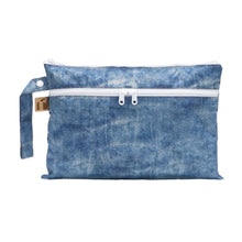 Load image into Gallery viewer, Roamio by Bumkins Wet/Dry Clutch: Crushed Denim is a zippered pouch with two compartments made of blue denim printed waterproof fabric.
