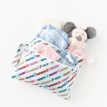 Load image into Gallery viewer, Bumkins Wet/Dry Clutch: Mickey &amp; Friends Varsity holds clothes, diapers, and a plush toy on a white background.

