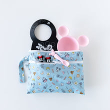 Load image into Gallery viewer, Bumkins Wet/Dry Clutch: Mickey + Minnie Sunny Side Up holds a black bib, pink plate, spoon, and two figures on a white background.
