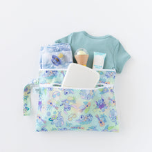 Load image into Gallery viewer, Bumkins Wet/Dry Clutch: Aloha Stitch holds clothes, diapers, and baby essentials on a white background.
