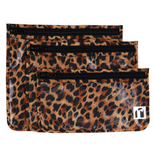 Load image into Gallery viewer, Roamio by Bumkins Clear Travel Bag 3 Pack: Leopard includes 3 TSA-compliant leopard print waterproof fabric pouches with zipper closures.
