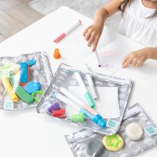 Load image into Gallery viewer, A child draws with colorful markers at a white table, surrounded by vibrant craft supplies in Bumkins Clear Travel Bag 3 Pack: Lunar Phase.
