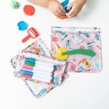 Load image into Gallery viewer, A child plays with modeling clay as markers are neatly stored in Bumkins Clear Travel Bag 3 Pack: Boots on a white table.
