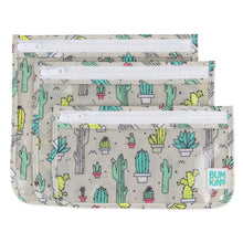 Load image into Gallery viewer, Bumkins Clear Travel Bag 3-Pack: Cacti includes 3 TSA-compliant pouches with cactus illustrations on gray waterproof fabric.
