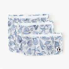 Load image into Gallery viewer, Roamio by Bumkins Clear Travel Bag 3 Pack: Shells lays overlapped on a white background.
