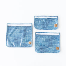 Load image into Gallery viewer, Roamio by Bumkins Clear Travel Bag 3 Pack: Crushed Denim is neatly arranged on a white background.
