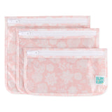 Bumkins Clear Travel Bag 3-Pack: Lace includes 3 TSA-compliant pouches made of pink waterproof fabric with a white lace design.