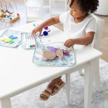 Load image into Gallery viewer, A curly-haired child plays with markers and toys in Bumkins Clear Travel Bag 3 Pack: Aloha Stitch at a white table.
