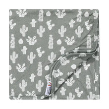 Load image into Gallery viewer, The Emerson and Friends Bamboo Blanket with Stay Sharp design is neatly folded, showing its gray color and cactus print.
