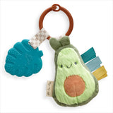 Itzy Ritzy's Itzy Pal Avocado: cute plush toy with ribbons and berry silicone teether—adorable for baby playtime!.