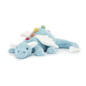 Jellycat Sky Dragon Large: A soft, light blue dragon with white wings and rainbow spikes, lying on its belly with a gentle gaze.