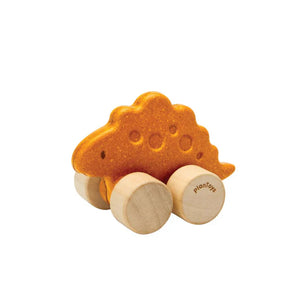 Dino Car, Stego: orange ruberwood dinosaur toy with tan wheels with PlanToys logo.