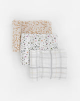 Little Unicorn Cotton Swaddle Set, Garden Bees: 3 muslin blankets—brown dot, floral, & gray grid—for swaddling or snuggling.