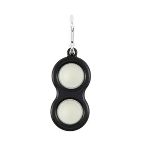 The Simpl Dimpl by Fat Brain Toy Co features a black, peanut shape with glow-in-the-dark covers and a metal clip for tactile fun.