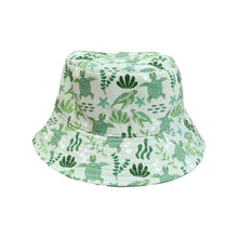 Load image into Gallery viewer, Emerson and Friends Reversible Bucket Hat, Sea Turtles: Baby/toddler hat with turtle and seaweed print on white.
