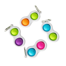 Load image into Gallery viewer, Four Simpl Dimpls by Fat Brain Toy Co with two colorful silicone buttons on white frames for tactile stimulation.
