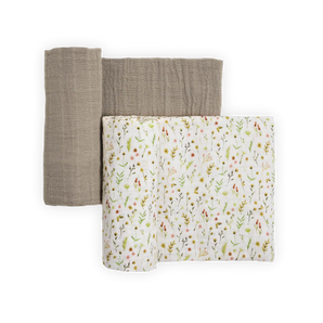 Two Little Unicorn Organic Cotton Muslin Swaddles—gray and floral—folded neatly on a white background.