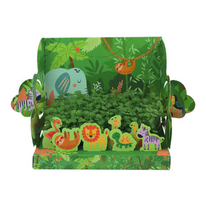 Discover Buzzy Seeds Pop-Up Garden, Jungle with cartoon lions, elephants, and zebras in vibrant green scenery.