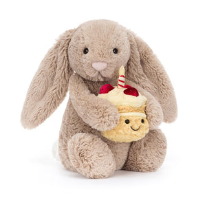 Jellycat Bashful Beige Bunny 'Birthday' holds a cupcake plush—a cute birthday gift, perfect from Jellycat.