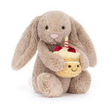 Jellycat Bashful Beige Bunny 'Birthday' holds a cupcake plush—a cute birthday gift, perfect from Jellycat.