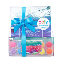 Load image into Gallery viewer, The OOLY Pearlescent Watercolor Gift Set includes 12 paints and Chroma Blends paper, wrapped with a blue ribbon and tag for projects.
