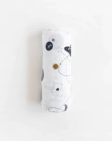 The Little Unicorn Cotton Swaddle, Planetary is a lightweight and breathable muslin adorned with planets and celestial designs.