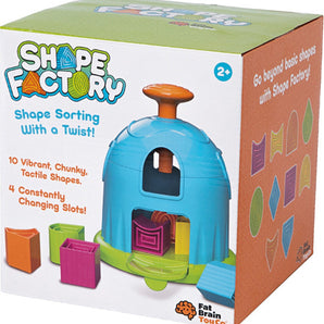 Box of Fat Brain Toy Cos Shape Factory includes colorful blocks and a shape-sorting puzzle for ages 2+ to enhance spatial skills.