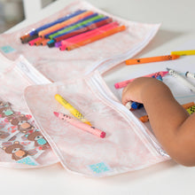 Load image into Gallery viewer, Close-up of a child reaching for crayons beside Bumkins Clear Travel Bag 3-Pack: Lace on a white table.
