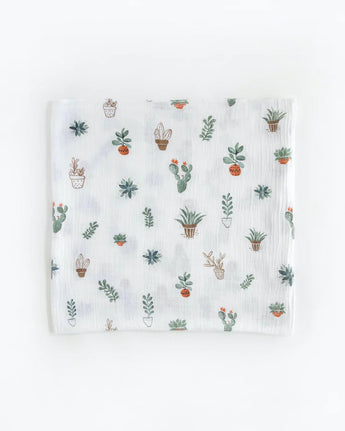 Little Unicorns Cotton Swaddle Set in Bison features a breathable white muslin cloth with a cute cactus and potted plant design.