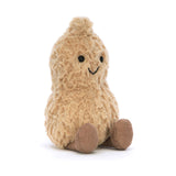 A plush, brown Jellycat Amuseables Peanut toy with a smiling face and round eyes sits on a white background.