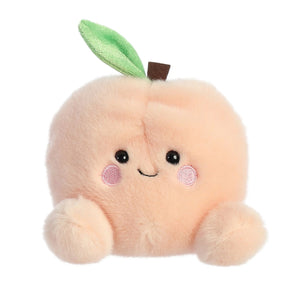Aurora Palm Pals Mellow Peach: a soft, plush peach toy with a smile, rosy cheeks, green leaf, and cute feet for comfy hugs.