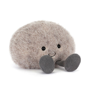 Meet Jellycat’s Amuseables Pebble: a plush, gray rock with soft dark gray feet and a friendly smile. Your cuddly companion!.