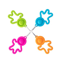 Load image into Gallery viewer, Four Lil Dimpl Keychains by Fat Brain Toy Co: star-shaped silicone bag hangers with rings in pink, green, blue, and orange.
