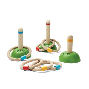 PlanToys Meadow Ring Toss: Eco-friendly game with 3 green stands, wooden pegs, and rope rings to improve fine motor skills.