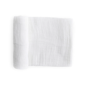 Little Unicorn's Cotton Swaddle, White, is a breathable baby blanket for delicate skin, shown folded on a plain white background.