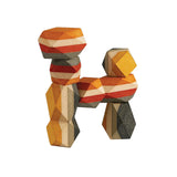 Geo Stacking Rocks by PlanToys is a geometric sculpture with orange, yellow, gray, and gold stone-like shapes resembling an abstract H.