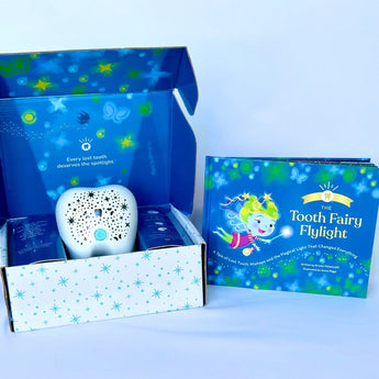 The Tooth Fairy Flylight Box Set by Tooth Fairy Flylight includes a storybook and projector nightlight in a starry box for the lost tooth tradition.
