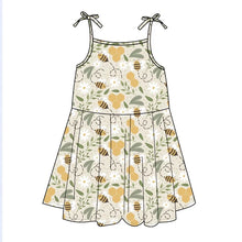 Load image into Gallery viewer, Illustration of Emerson and Friends Sundress in Happy Honey Bees pattern with green, white, gold tones and bow straps.
