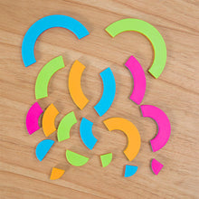 Load image into Gallery viewer, The Bugzzle Game by Fat Brain Toy Co uses colorful geometric shapes in green, blue, pink, and orange for a math challenge on wood.
