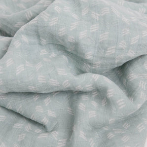 Little Unicorn’s Cotton Swaddle, Misty Field: light blue muslin with white geometric pattern, soft and breathable for babies.