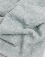 Little Unicorn’s Cotton Swaddle, Misty Field: light blue muslin with white geometric pattern, soft and breathable for babies.