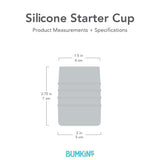 Gray silhouette of Bumkins Silicone Starter Cup with dimensions—top width: 1.5 in (4 cm), height: 2.75 in (7 cm), bottom width: 2 in (5 cm).